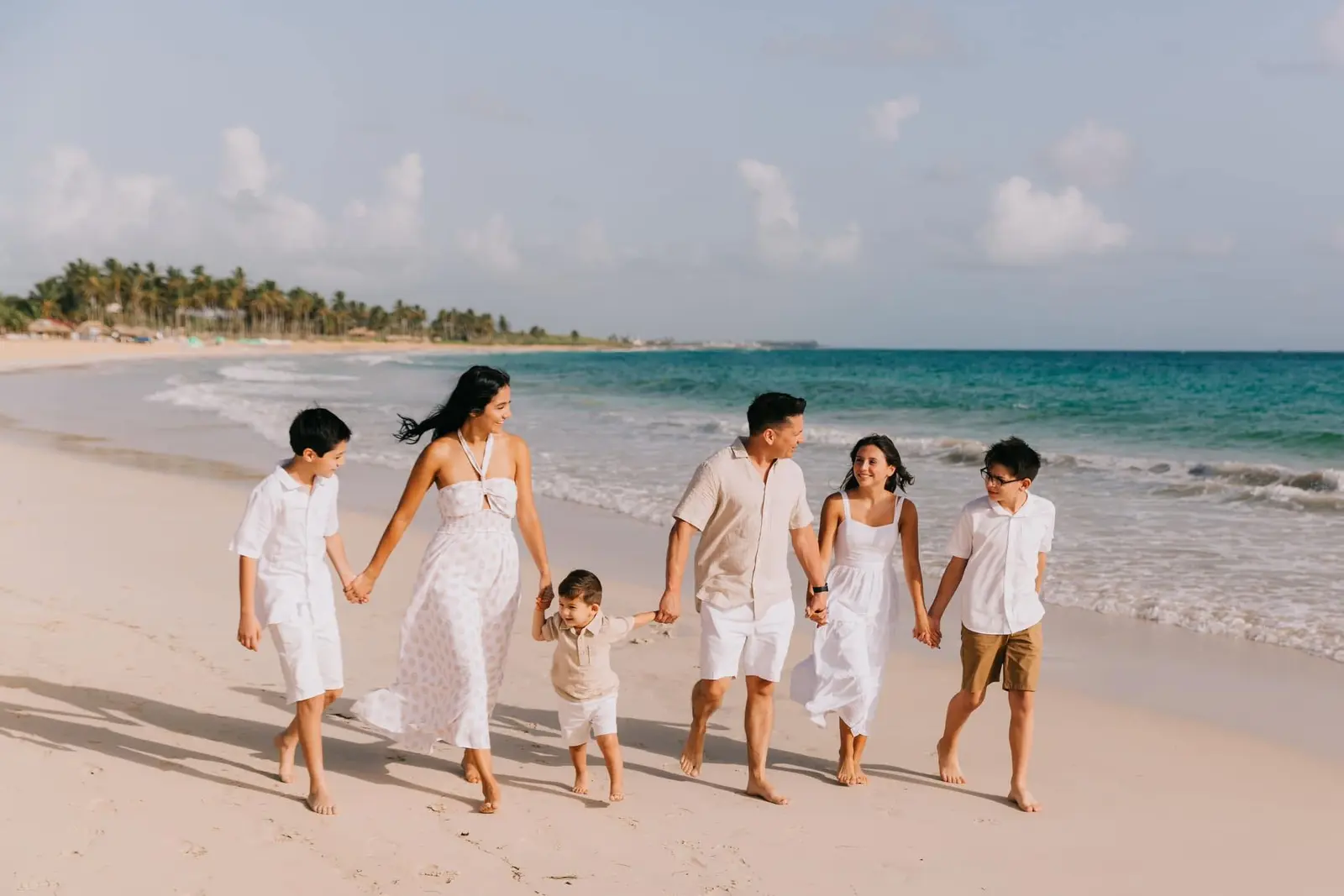 Sergio Norzagaray walking on the beach with his family